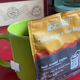 Mug of coffee with bag that reads "coffee in a tea bag"